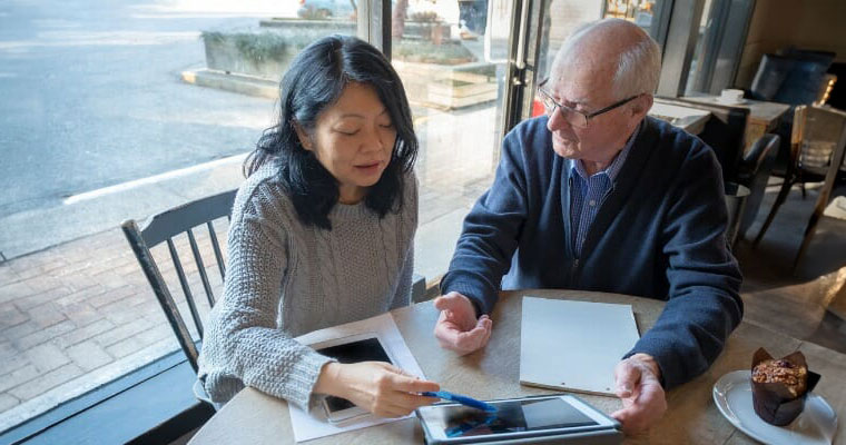 reviewing financial information on digital tablet